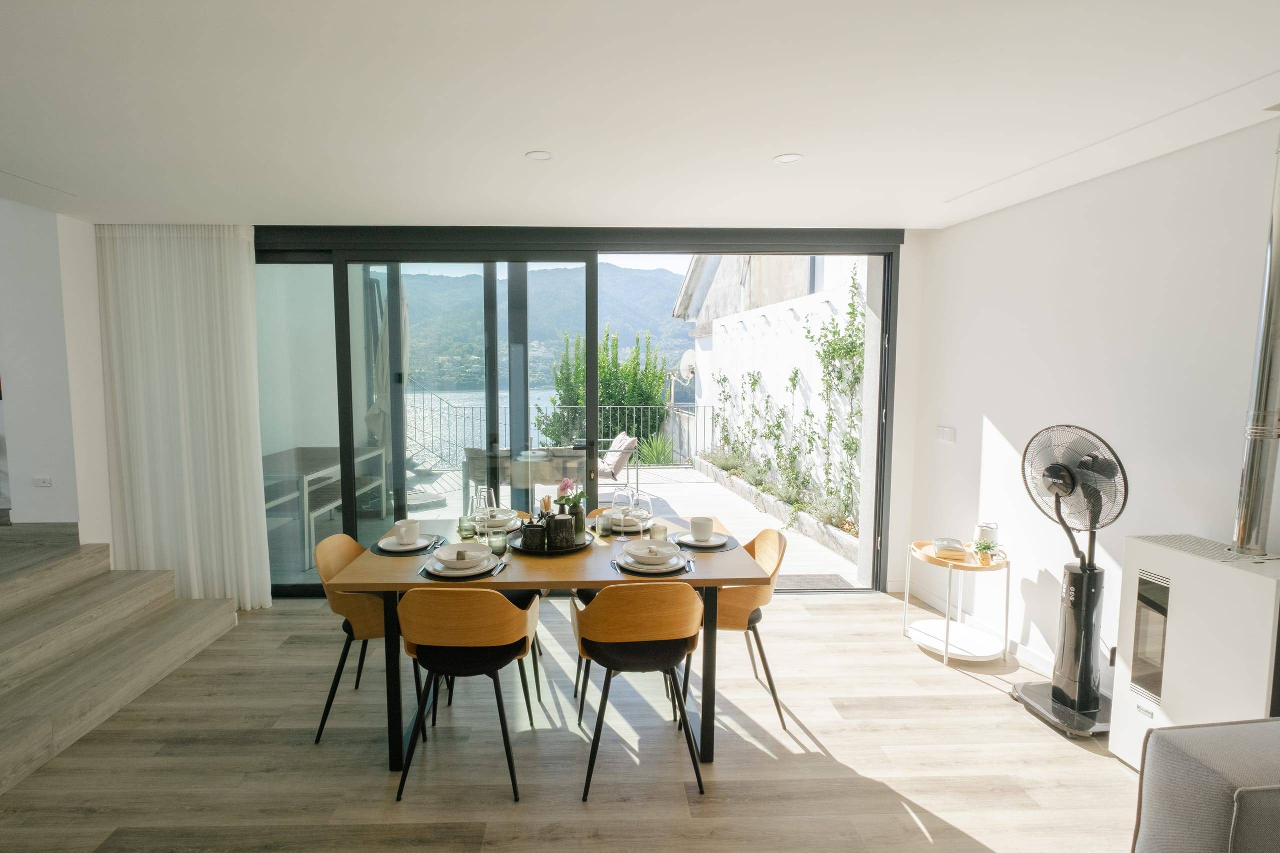 Dining table for six by the glass doors